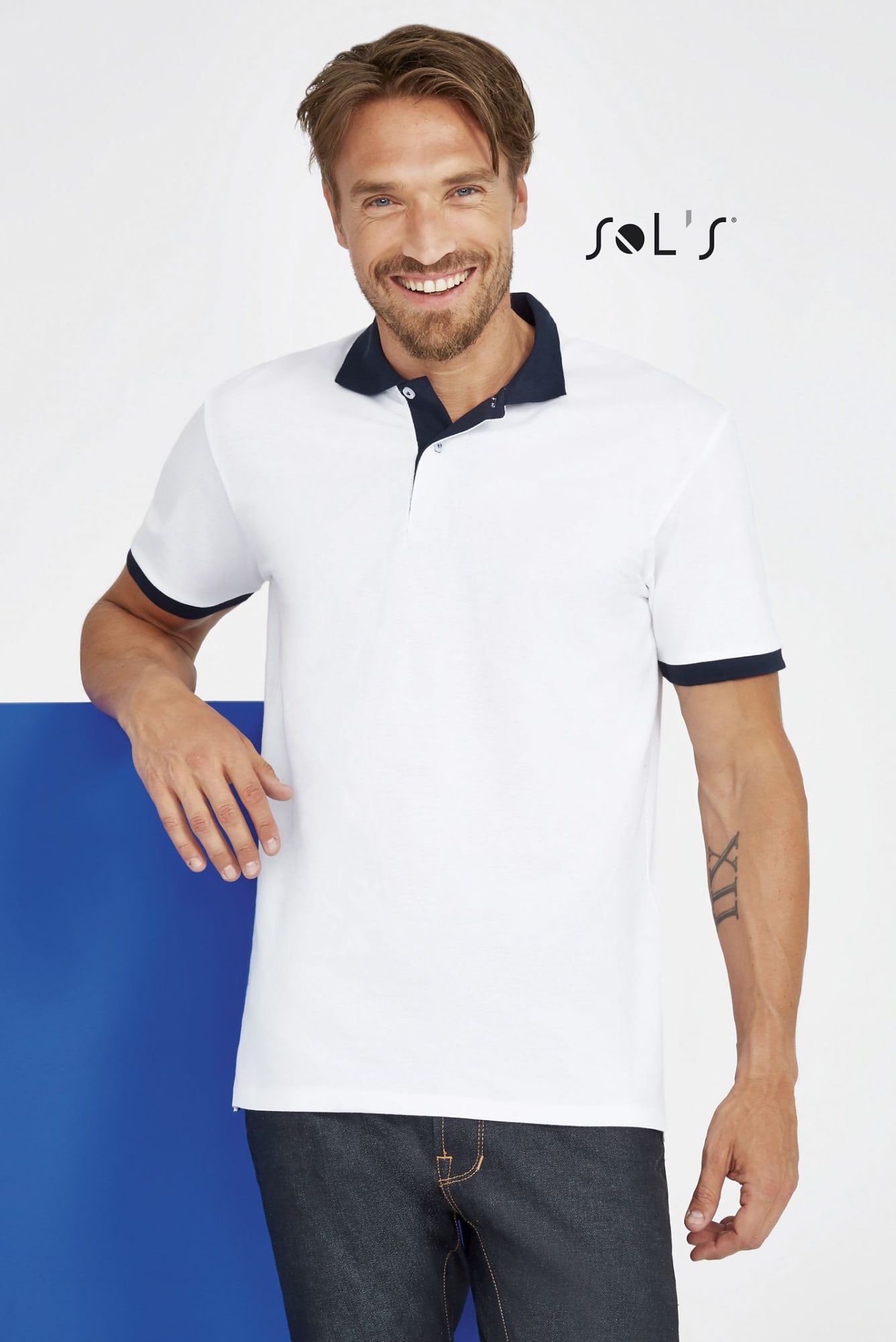 A unisex polo shirt in white with a navy blue collar, made from 100% ring spun cotton, featuring a logo. Polo shirt Unisex 100% ring spun cotton PRINCE - Image 1