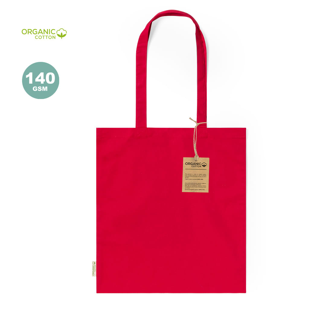 A red tote bag made from organic cotton with long handles and a tag. It has a branding logo. Klimbou Bag - Image 1