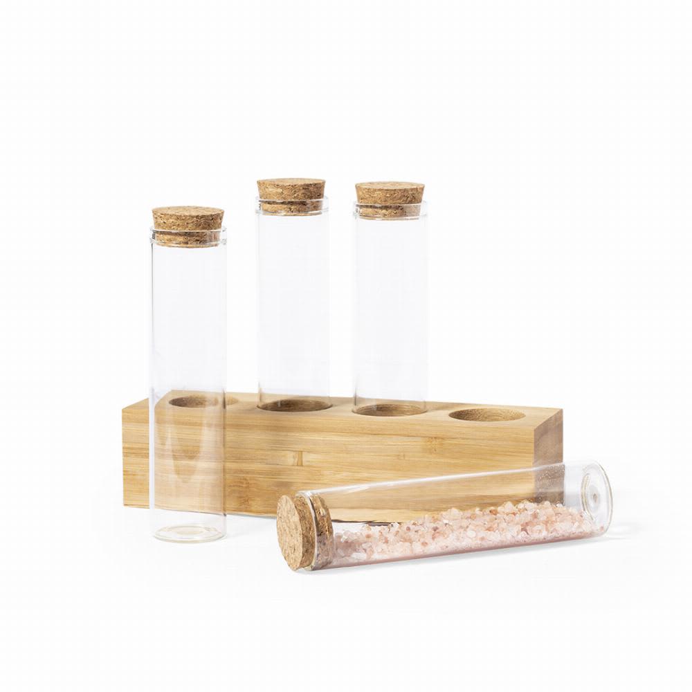 A set of clear glass tubes with cork caps, featuring one filled with pink salt, displayed on a bamboo stand. Tumber - Image 1