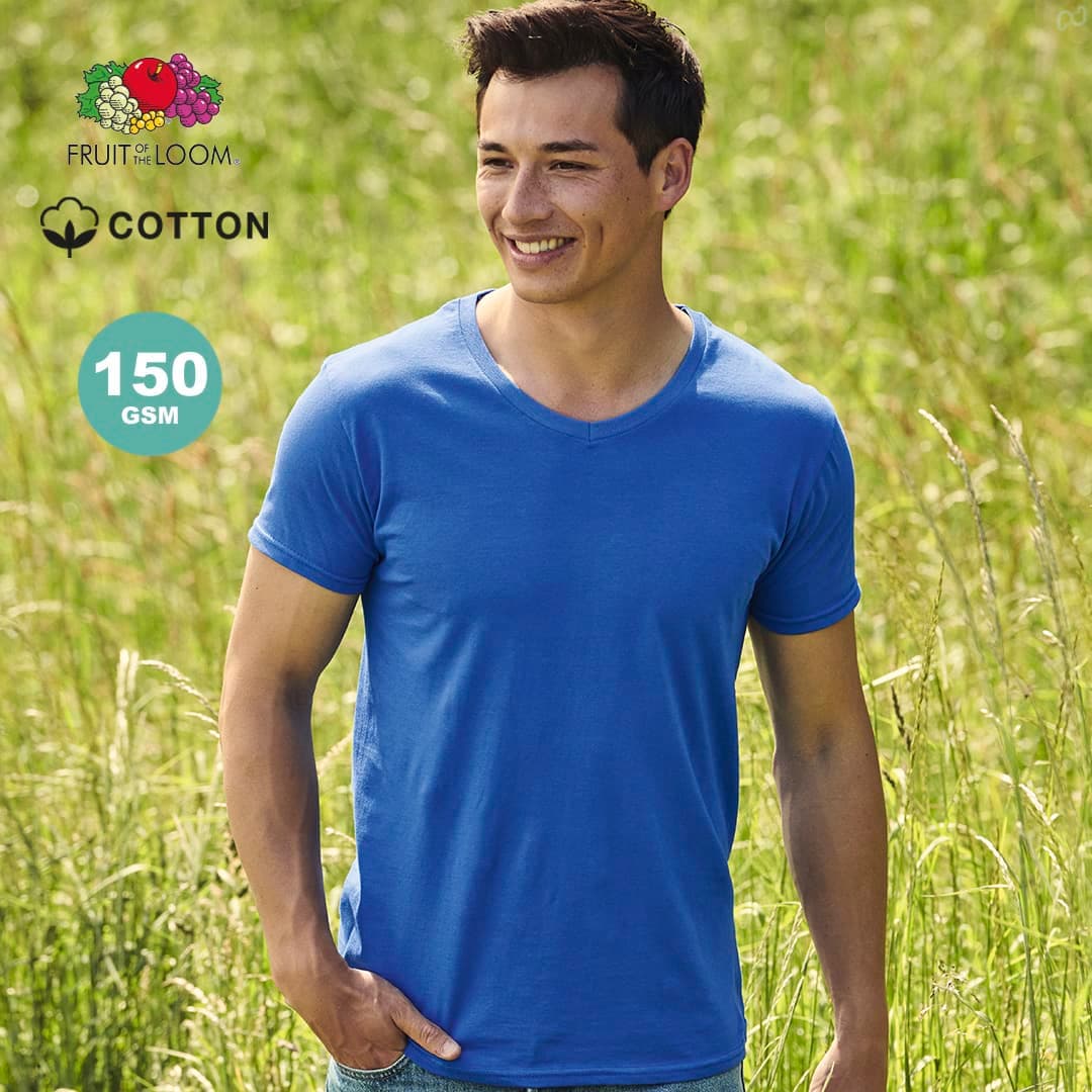 A blue adult V-neck T-shirt made of cotton, displayed outdoors on a smiling model in a grassy field. Iconic V-Neck Adult Colour T-Shirt - Image 1