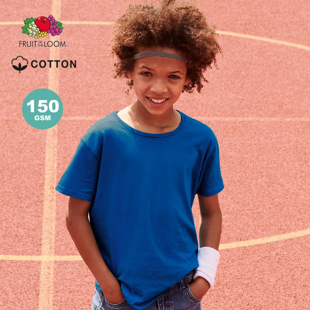 A blue T-shirt made of cotton, featuring a logo, worn by a child on a sports court. Iconic Kids Colour T-Shirt - Image 1