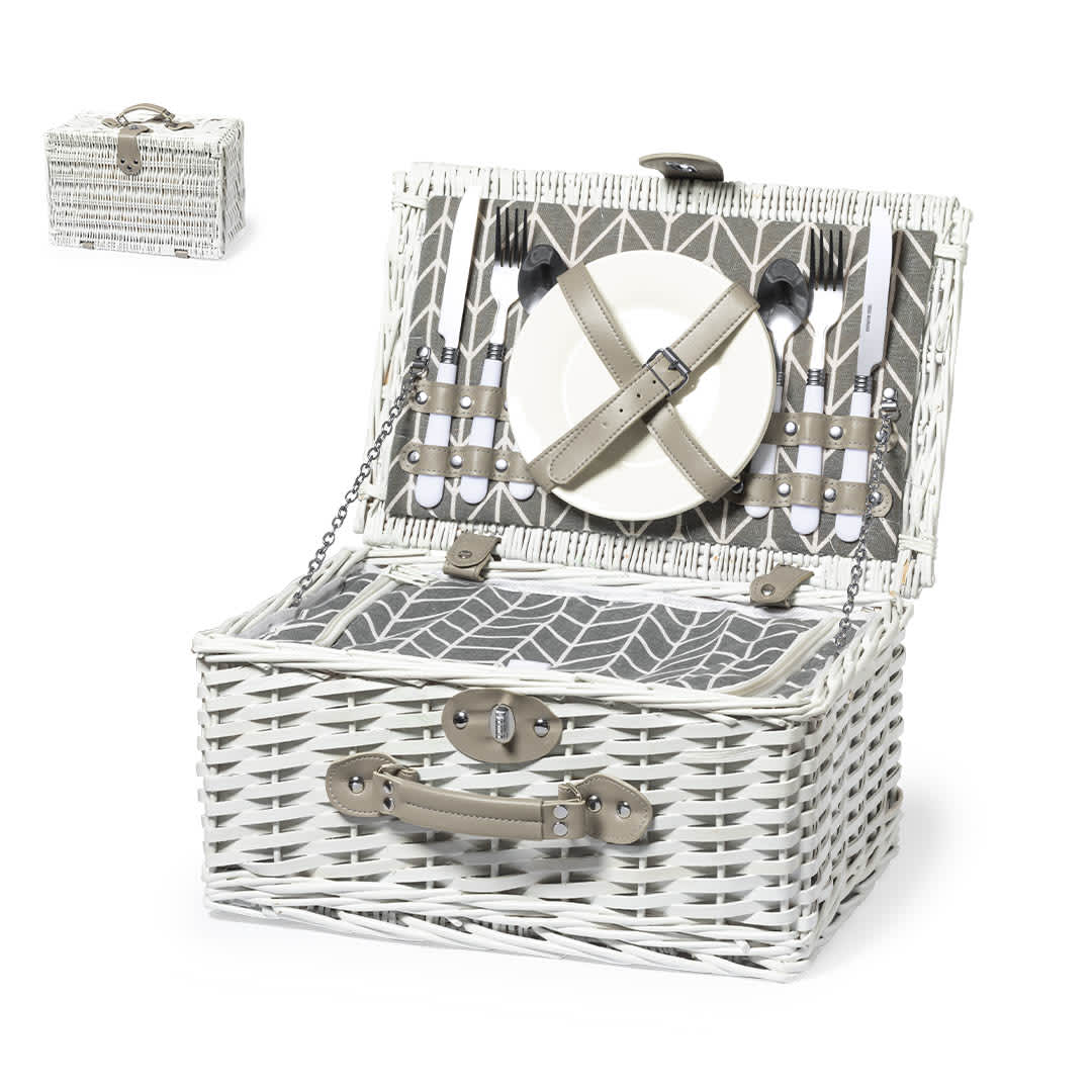 A thermal picnic basket in white wicker, featuring utensils and a plate secured inside with straps. Midland Thermal Picnic Basket - Image 1