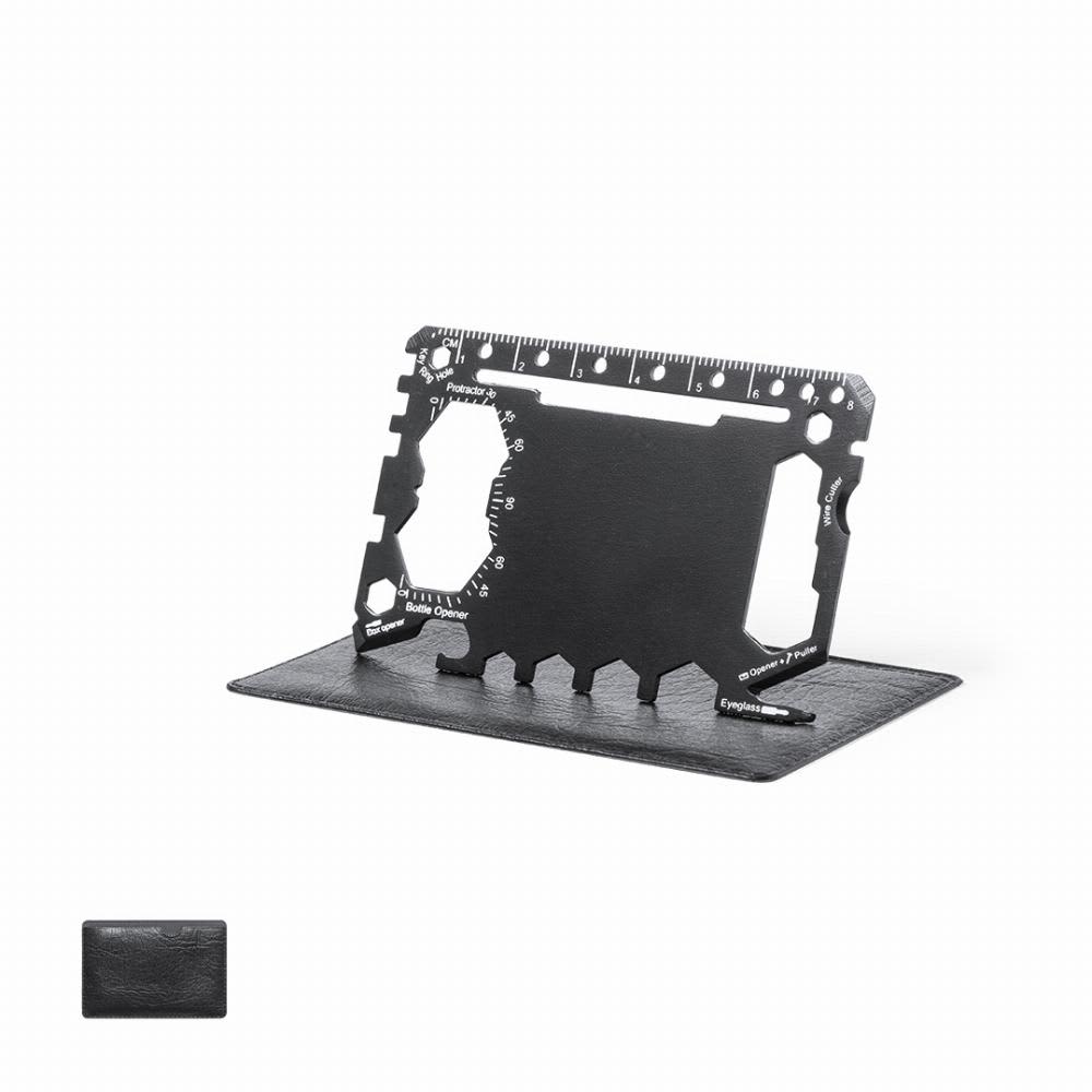 A multi-tool card in black, featuring various functions and measurements, displayed on a leather-like holder. Frest - Image 1