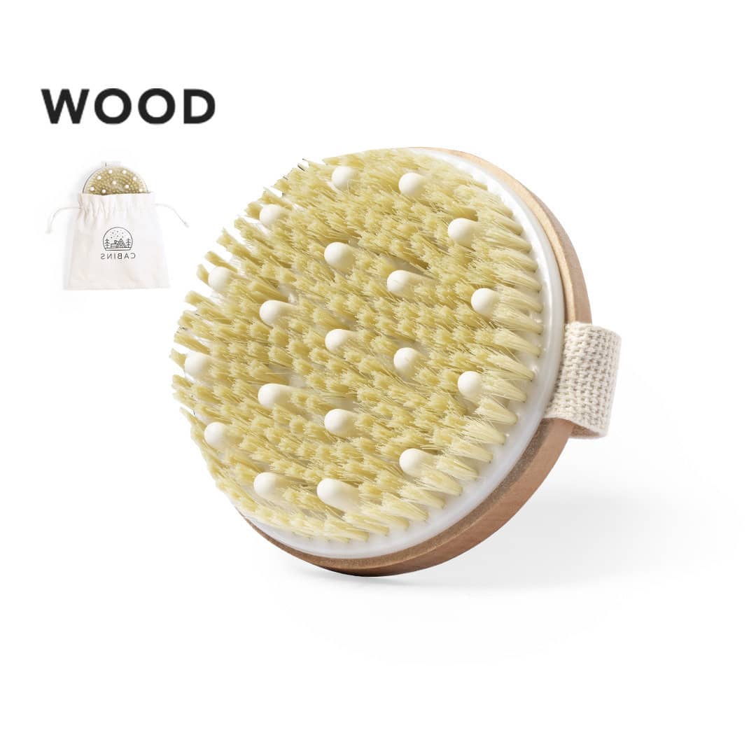 A wooden exfoliating massage brush with a cream-coloured bristle head and a fabric handle, includes a storage bag. Ruck Exfoliating Massage Brush - Image 1