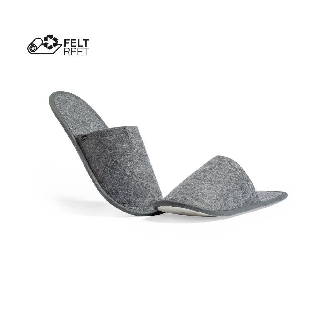 A pair of grey felt slippers with a grey sole, featuring a logo in the top corner. Kaicel - Image 1