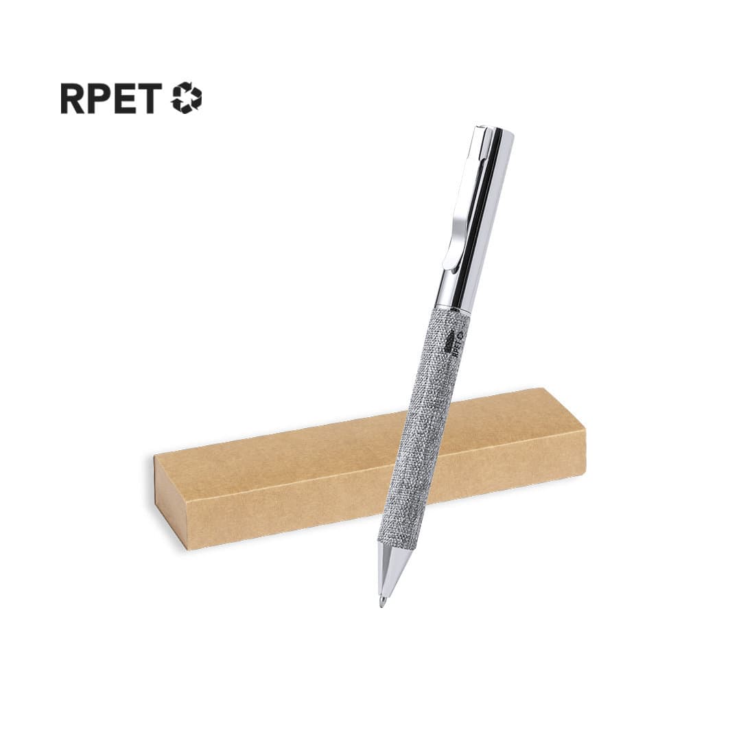 A silver metal pen with a textured grip, displayed beside a brown cardboard box, featuring a logo. Higolf Pen - Image 1