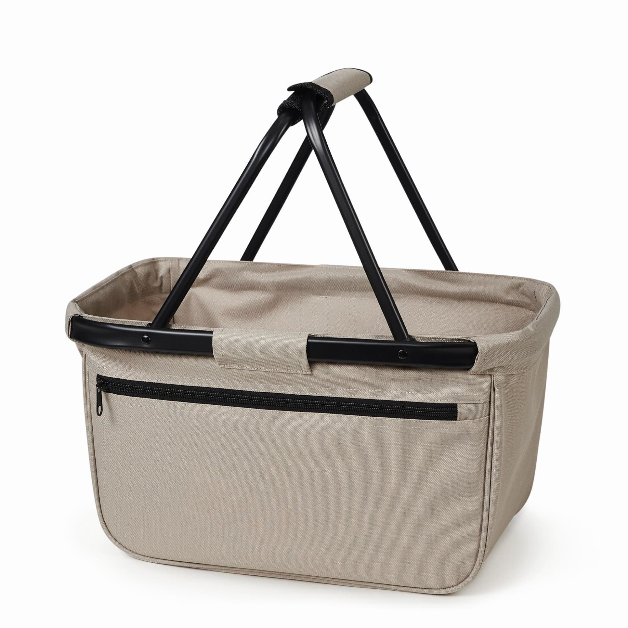 A beige shopper basket with a black frame and handle, featuring a zippered pocket on one side. Blackbasket Shopper - Image 1