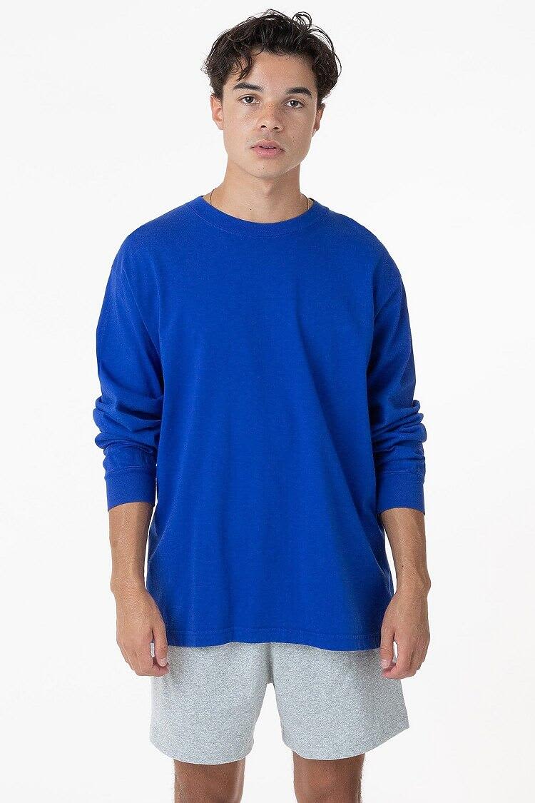 A long sleeve crewneck tee in bright blue, featuring a relaxed fit. The model wears grey shorts. Long Sleeve Garment Dye Crewneck Tee - Image 1