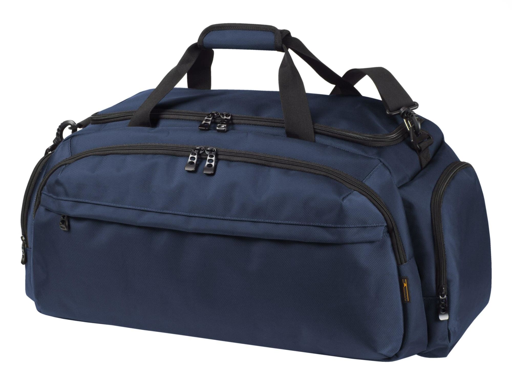 A navy blue duffle bag with multiple zippered compartments and short handles, featuring a shoulder strap. Mission Sport/Travel Bag - Image 1