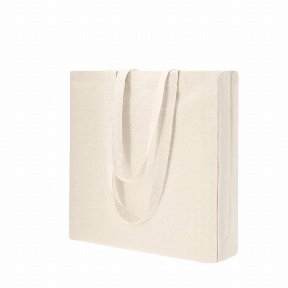 A tote bag in a natural cream colour with two long handles and a simple design. Bidal - Image 1