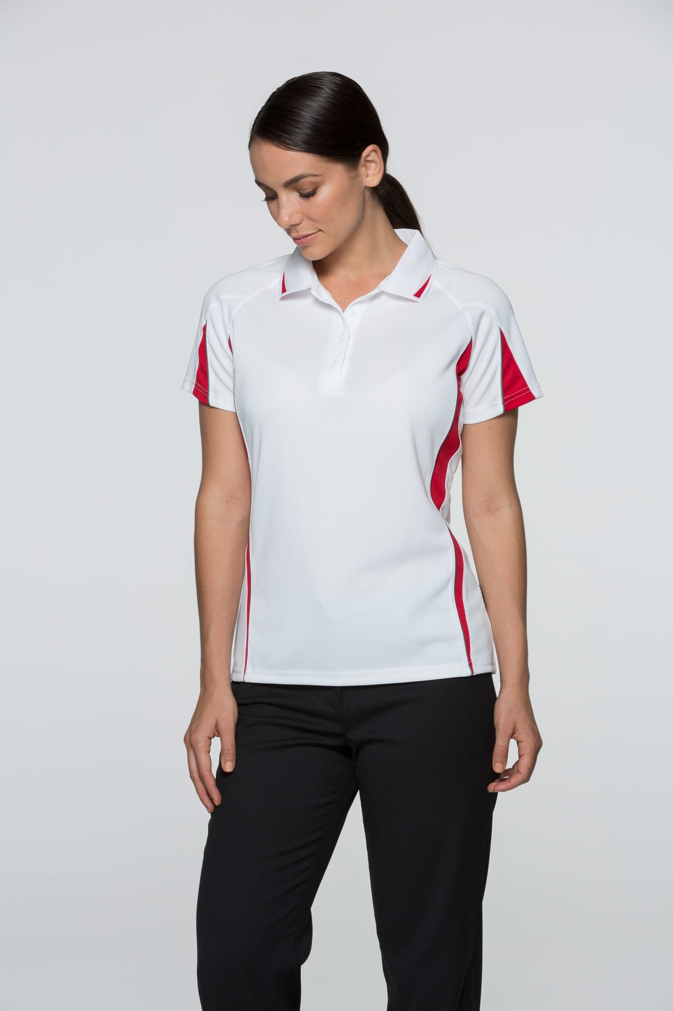 A polo shirt in white with red accents, featuring a collar and short sleeves. It has a logo on the chest. EUREKA LADY POLOS RUNOUT - Image 1
