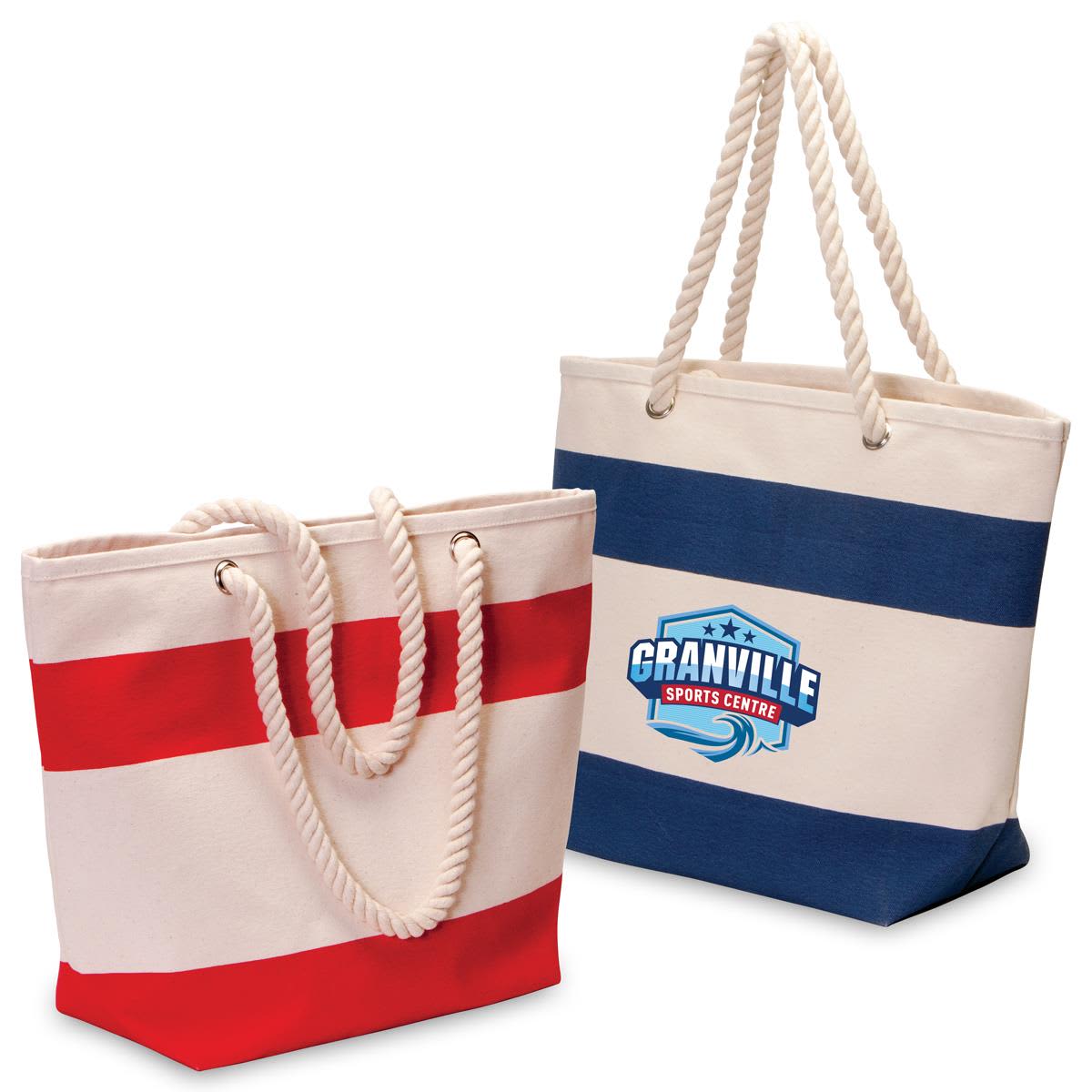 Two cotton canvas tote bags, one with red stripes and the other with navy stripes, featuring a logo on the navy bag. Soho Cotton Canvas Tote - Image 1