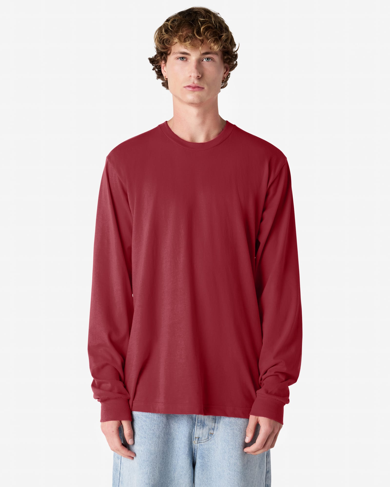 A red long sleeve T-shirt with a relaxed fit and a simple design, featuring a brand logo. American Apparel Fine Jersey Long Sleeve T-Shirt - Image 1