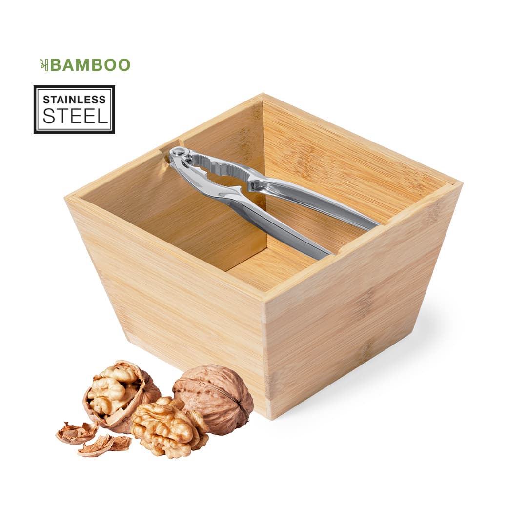 A bamboo bowl with stainless steel tongs, featuring walnuts and a cracked shell beside it. Batsly - Image 1