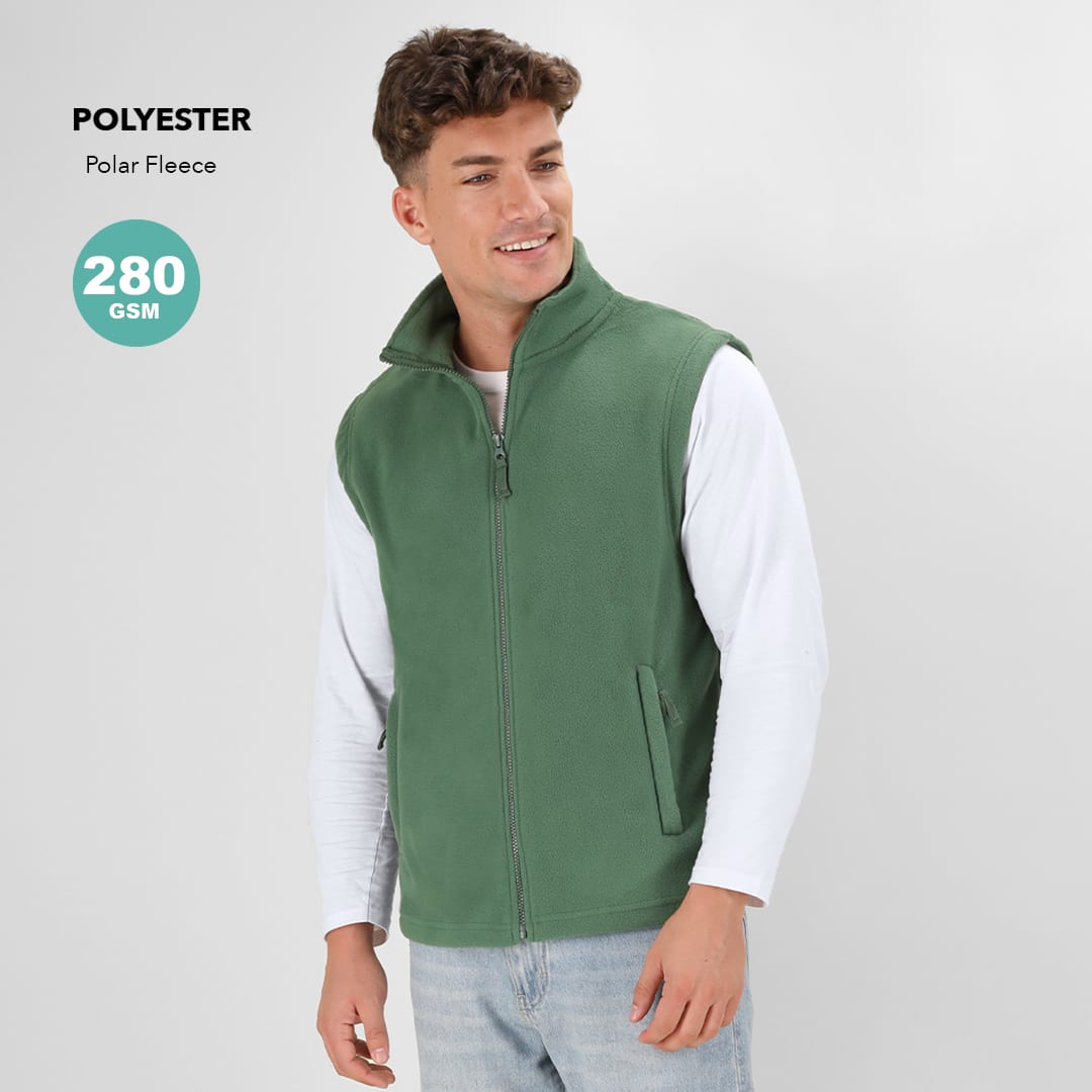 A green polar fleece vest with a zip and side pockets, featuring a logo. Styled with a white long-sleeve top. Destin Vest - Image 1
