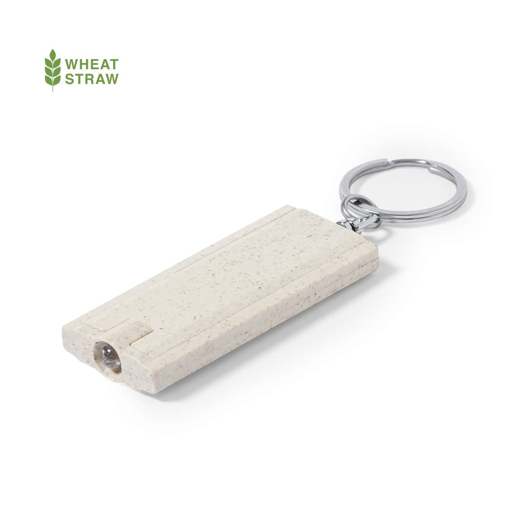 A wheat straw torch keyring in a light colour, featuring a keyring attachment and a small light. Tasex Torch Keyring - Image 1