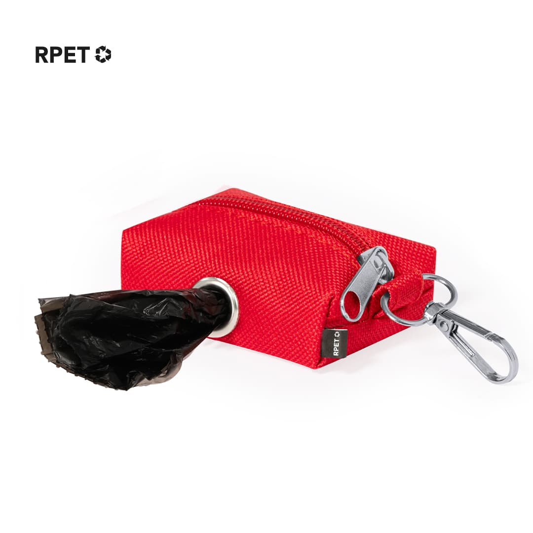 A red waste bag dispenser featuring a zip closure and a clip, with a black waste bag partially visible. Seperd Waste Bag Dispenser - Image 1