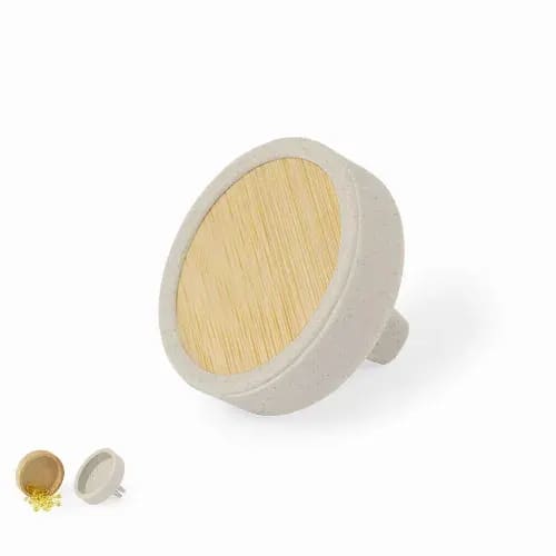 A round, grey product with a wooden top, featuring a small nozzle for dispensing contents. Roketa - Image 1