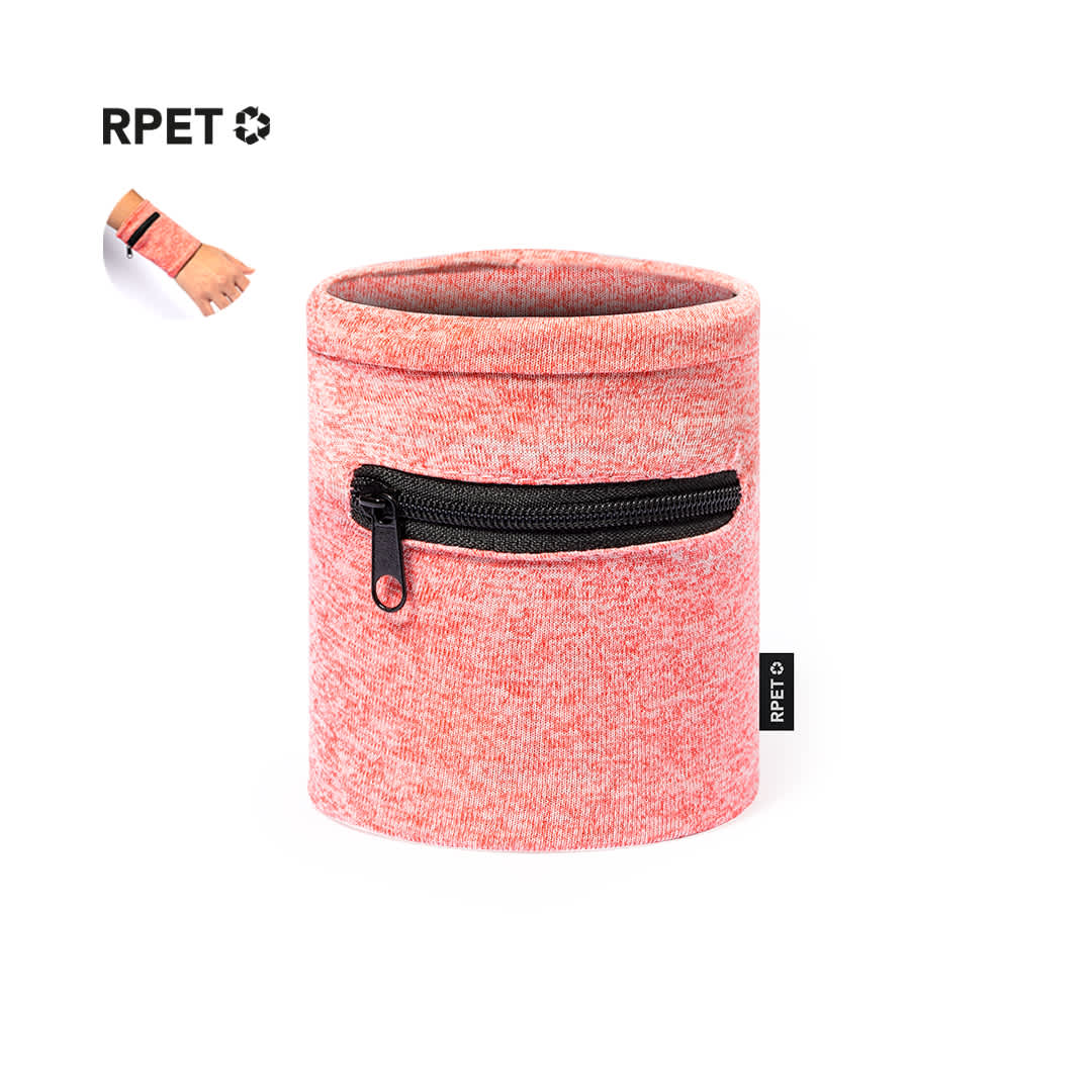 A pink Rolins Wristband with a zippered pocket, presented in a cylindrical container. It features a logo. Rolins Wristband - Image 1