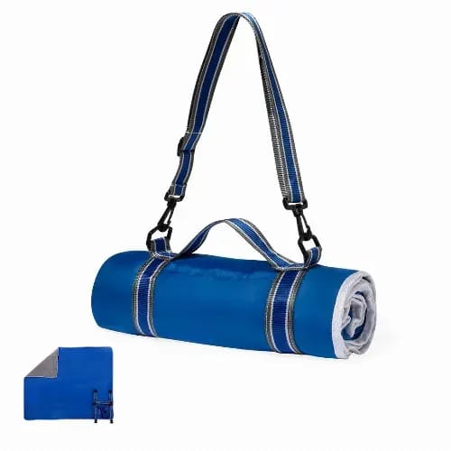 A rolled-up blue picnic blanket with a grey underside, featuring a shoulder strap and adjustable buckles. Zoran - Image 1