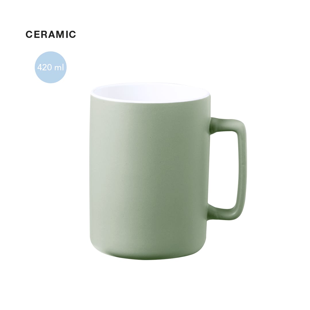A ceramic coffee mug in a soft green colour with a white interior, featuring a sturdy handle and 420 ml capacity. Kubaya Mug - Image 1