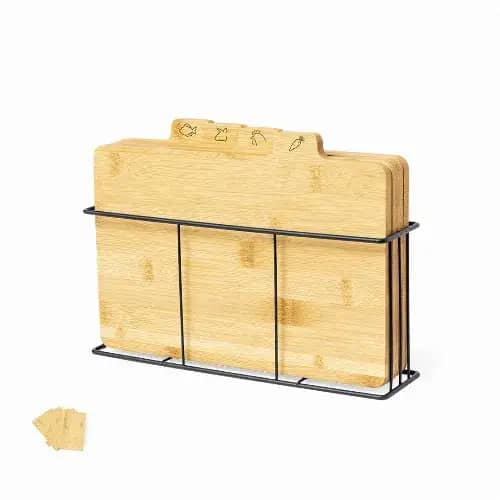 A set of bamboo cutting boards in a black wire holder, featuring engraved icons on the boards. Sendak - Image 1