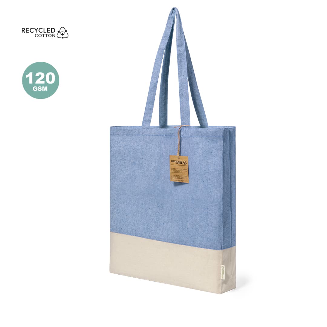 A blue and beige tote bag made from recycled cotton, featuring long handles and a tag. Kauna Bag - Image 1