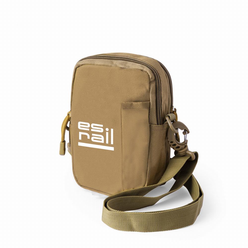 A khaki-coloured compact bag with a zip closure, adjustable strap, and a logo on the front. Gertler - Image 1