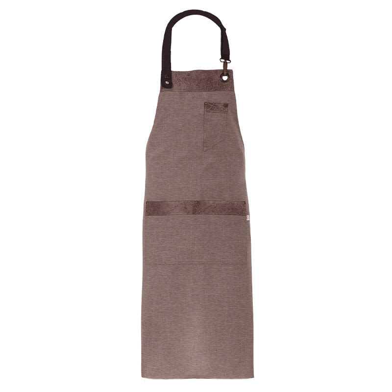 A brown apron with a pocket and adjustable neck strap, featuring a logo on the front. Tropez Apron - Image 1