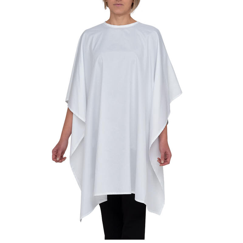 A white cape with a loose, flowing design, worn by a model against a plain background. Features a simple style. Zoe Cape - Image 1