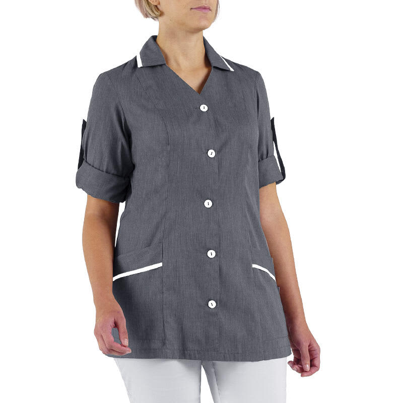 A grey tunic with short sleeves, white buttons, and contrasting white trim on the pockets and collar. Betty Tunic - Image 1