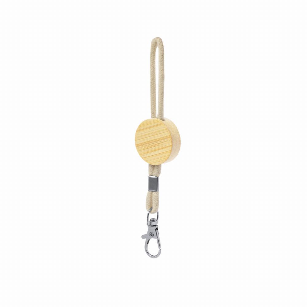 A wooden key holder with a round disc and a metal clasp, featuring natural wood tones and a woven cord. Pradim - Image 1