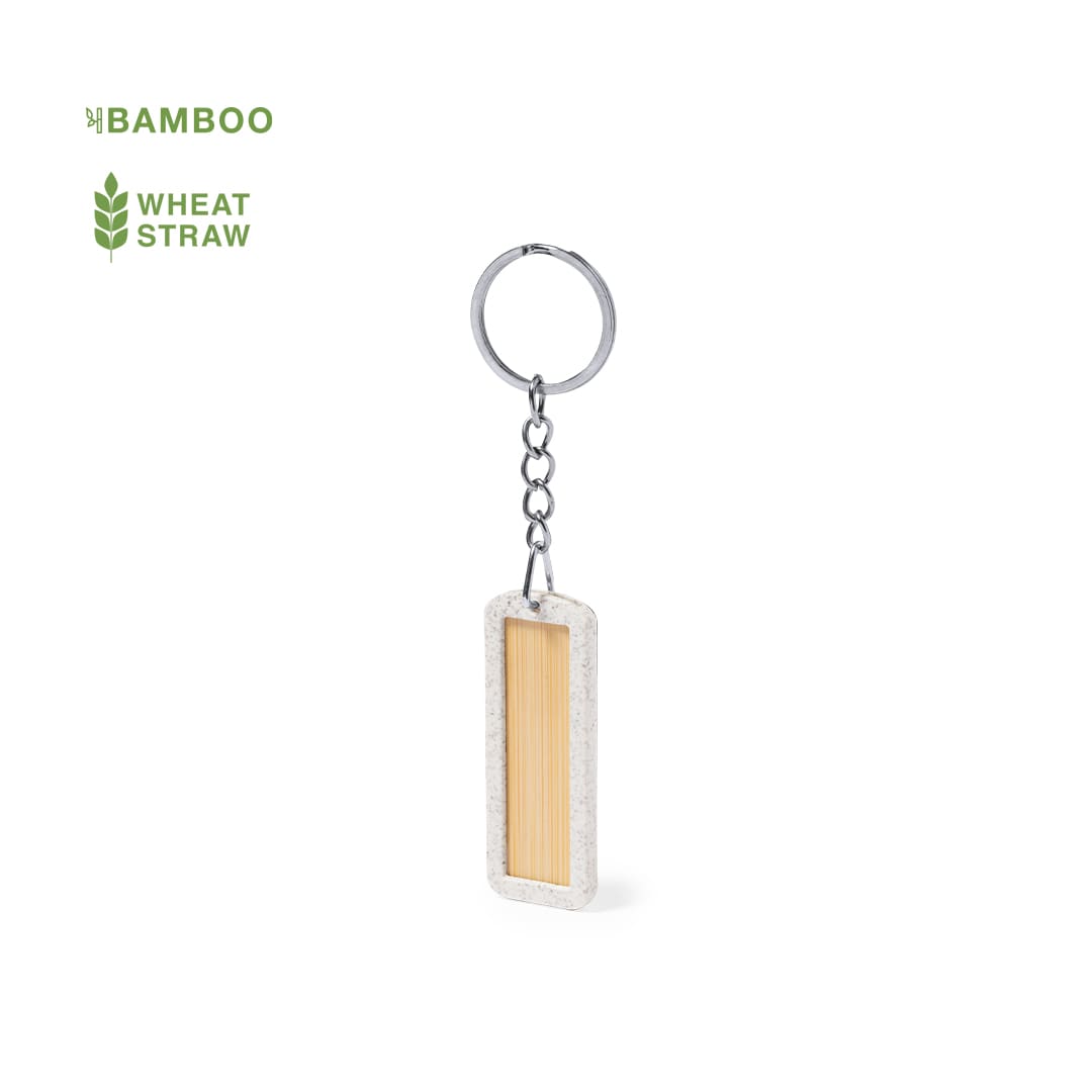 A keychain featuring a rectangular design made of bamboo and wheat straw, with a metal ring attached. Veterson - Image 1