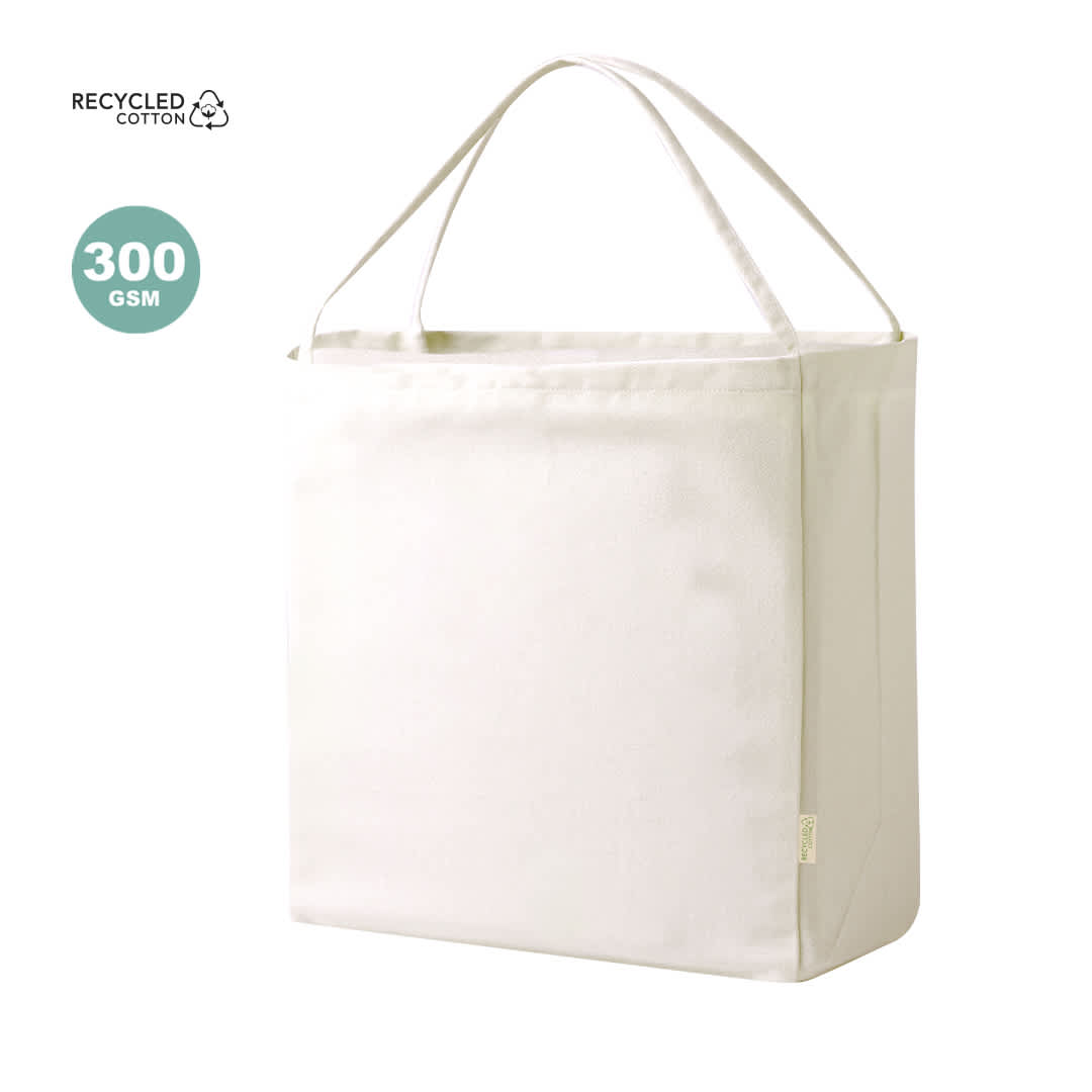 A cream tote bag made of recycled cotton with two handles and a plain design. It includes a logo. Yaponic Bag - Image 1