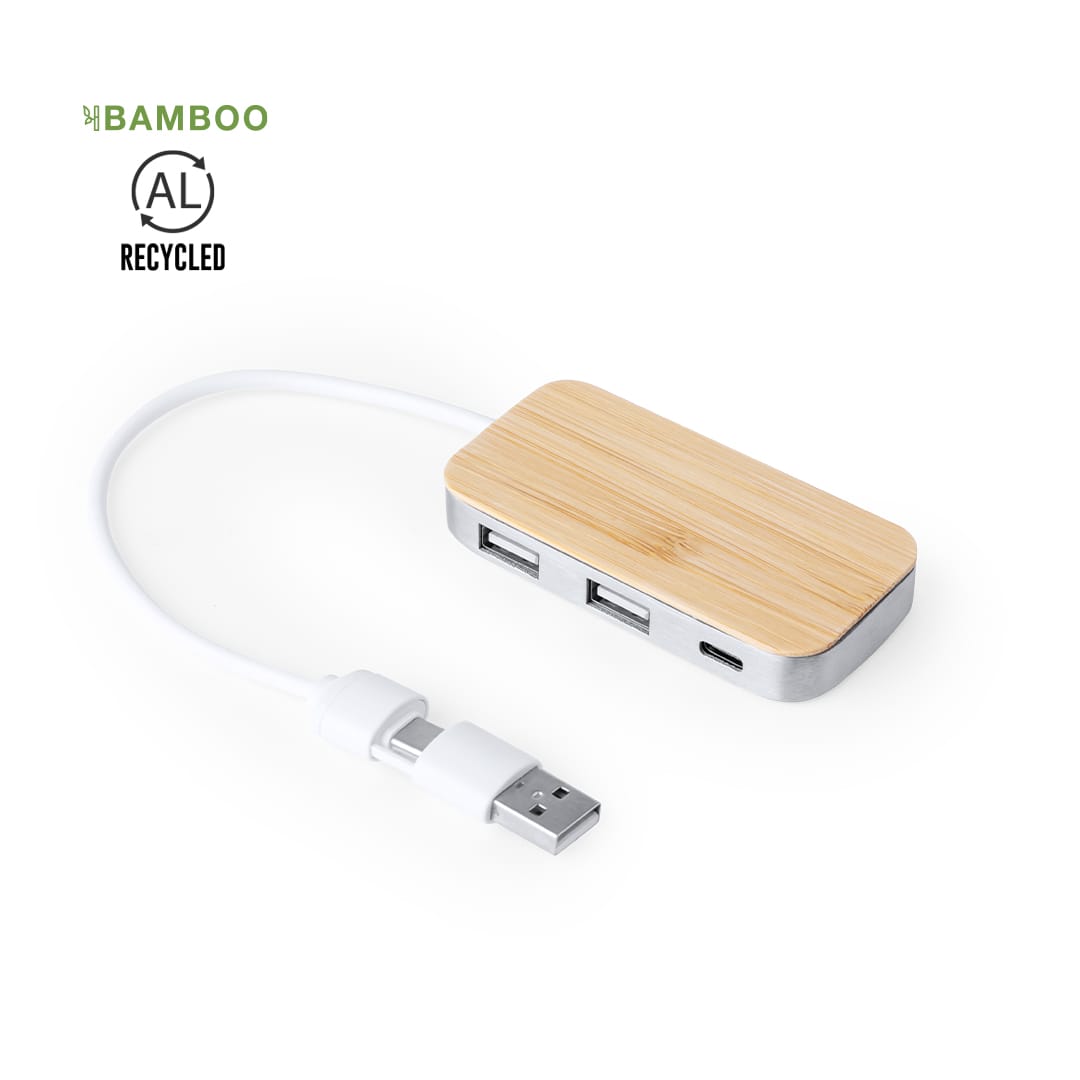 A bamboo USB hub with a silver base, featuring multiple ports and a white cable attached. Zurk USB Hub - Image 1