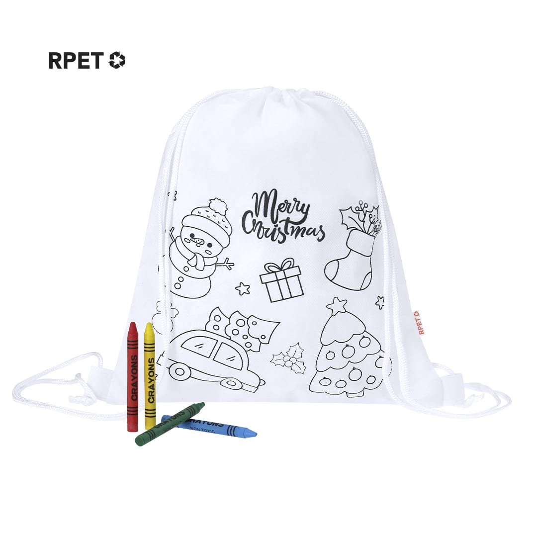 A white drawstring bag featuring holiday designs, accompanied by red, green, and yellow crayons. Taky Drawstring Bag - Image 1
