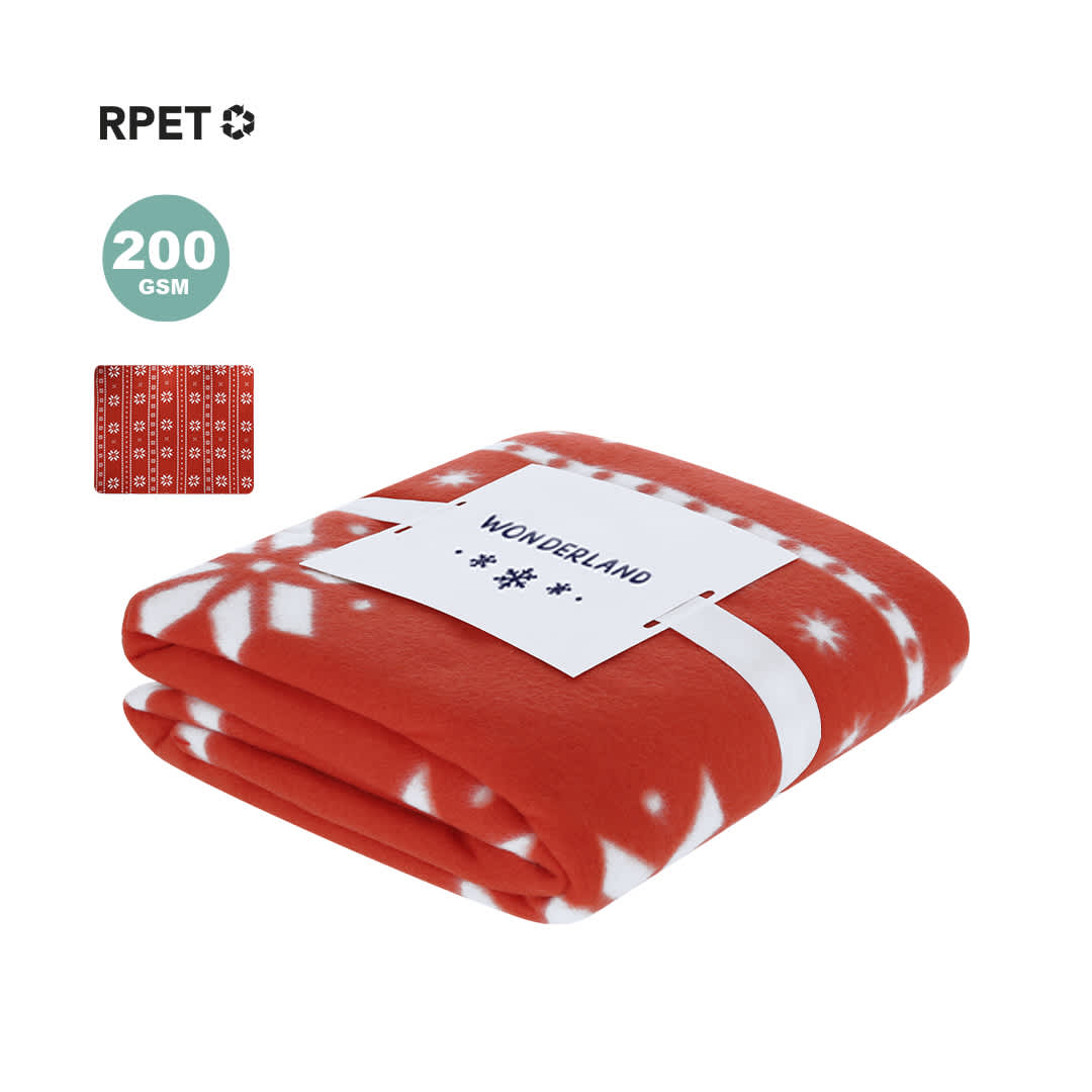 A folded orange blanket with a snowflake design, featuring a label and a branded logo. Yalanny Blanket - Image 1