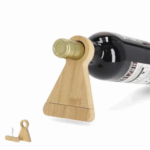 A wine bottle holder made of bamboo featuring a light brown triangular base and a corkscrew attachment. Kofko - Image 1