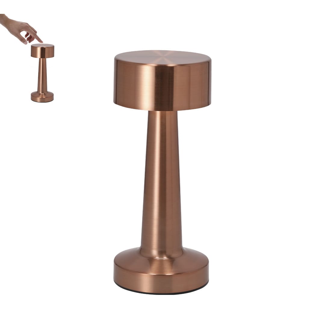 A copper-coloured lamp with a cylindrical base and a round shade, featuring a hand reaching towards it. Rosity Lamp - Image 1