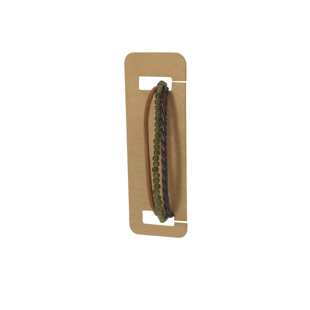 A green and brown bracelet featuring braided leather and beaded elements, displayed on a cardboard backing. Sonja Bracelet - Image 1