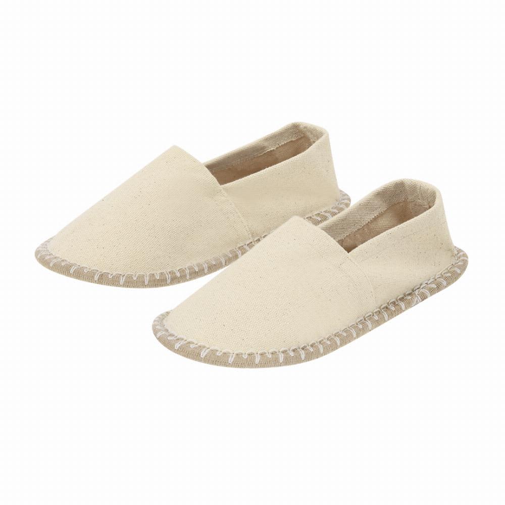 A pair of beige slippers featuring a simple design with stitched edges and an open back. Sergen - Image 1