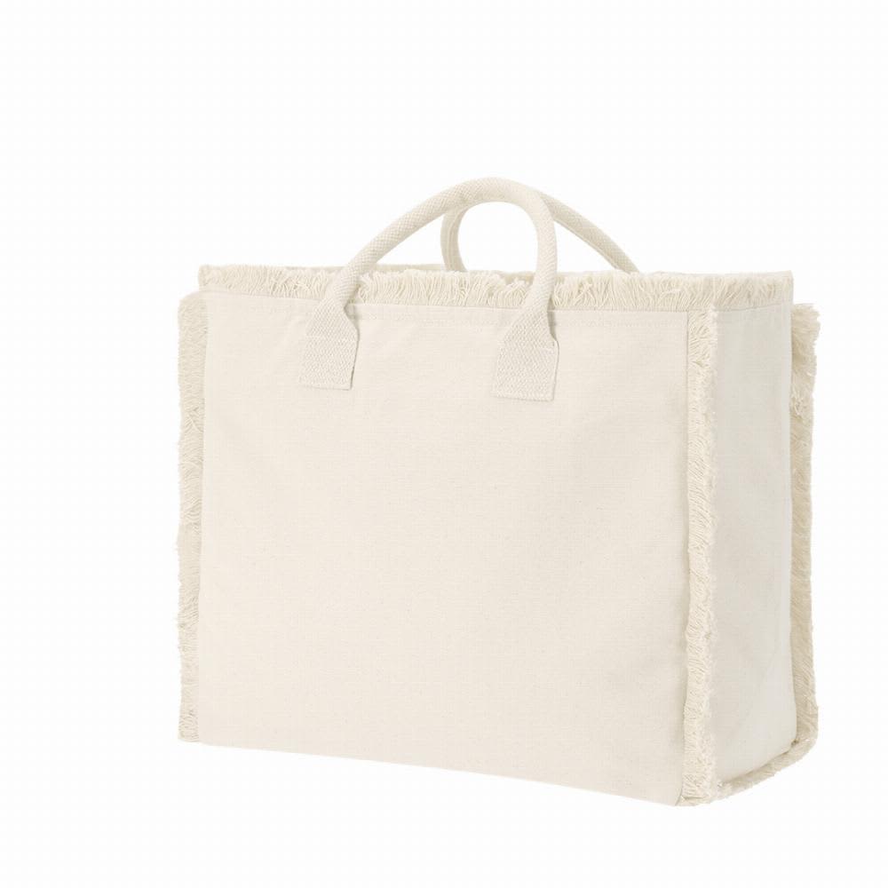 A large, cream-coloured tote bag with woven fringe detailing and sturdy handles. Dinebor - Image 1