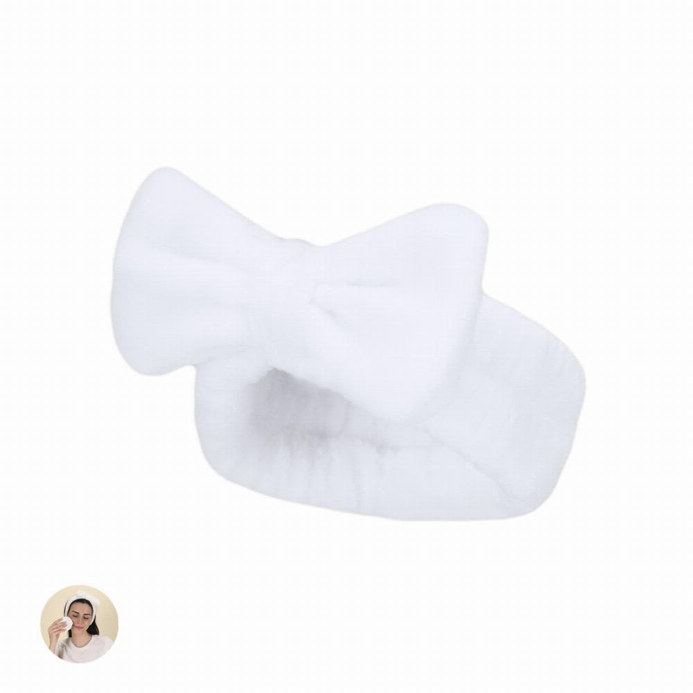 A white, fluffy headband with a bow design is displayed on a plain background. Brener - Image 1
