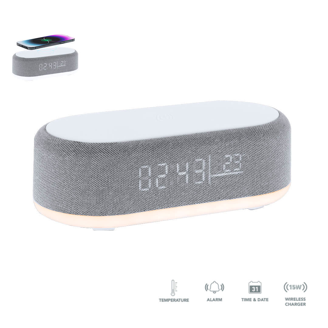 A grey multifunction alarm clock with a wireless charger, displaying time, temperature, and a light base. Quinn Multifunction Alarm Clock - Image 1