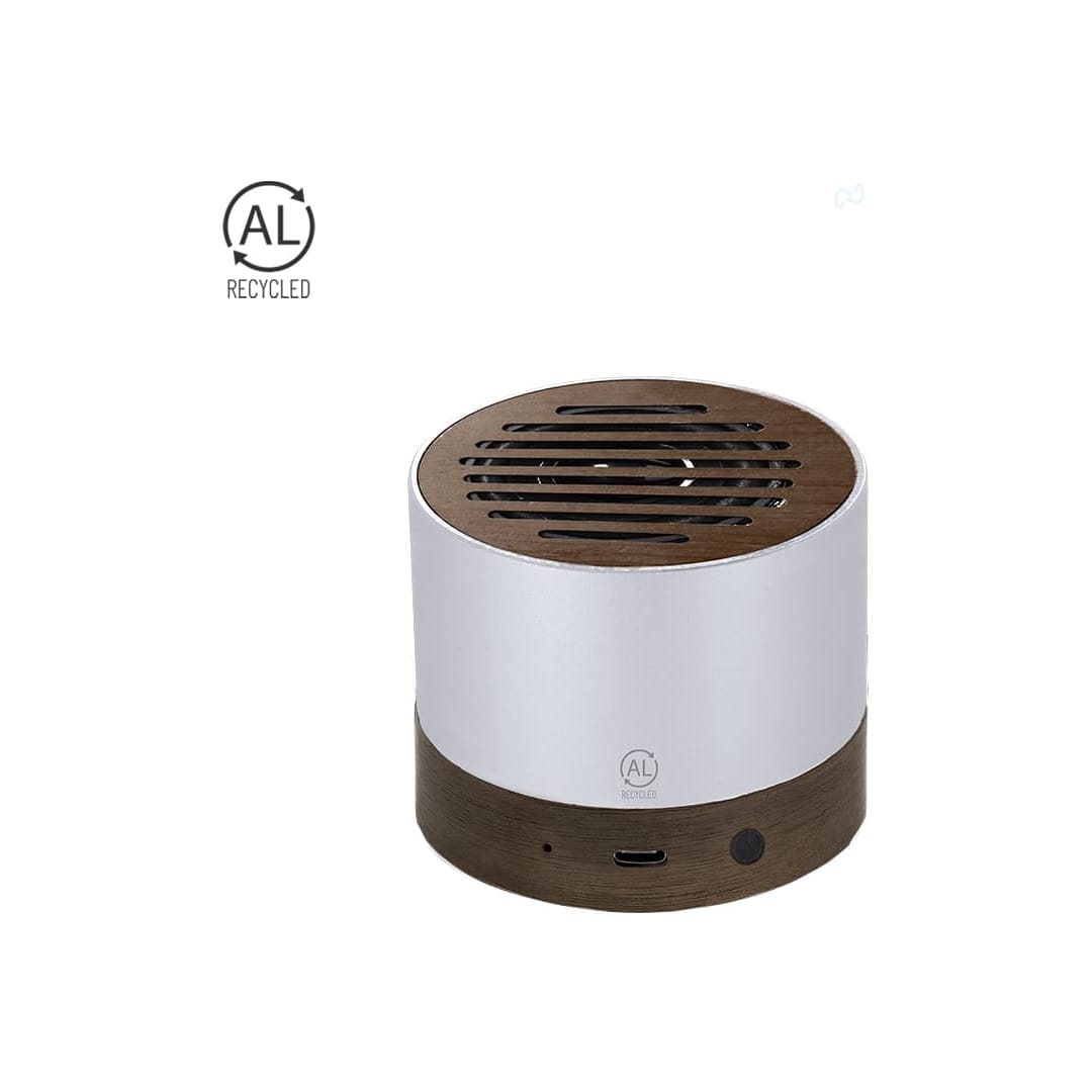 A cylindrical speaker with a silver body and a wooden base, featuring a vented top and a logo. Kolin Speaker - Image 1