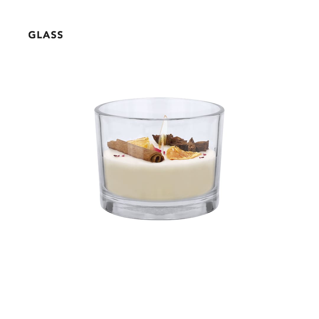 A glass aromatic candle featuring a creamy white wax base, decorated with cinnamon, dried orange, and petals. Dempsey Aromatic Candle - Image 1