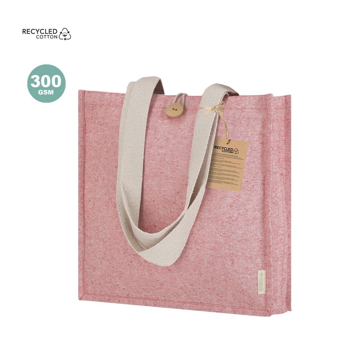 A pink tote bag made from recycled cotton, featuring a beige handle and a tag, with a logo. Brotax Bag - Image 1