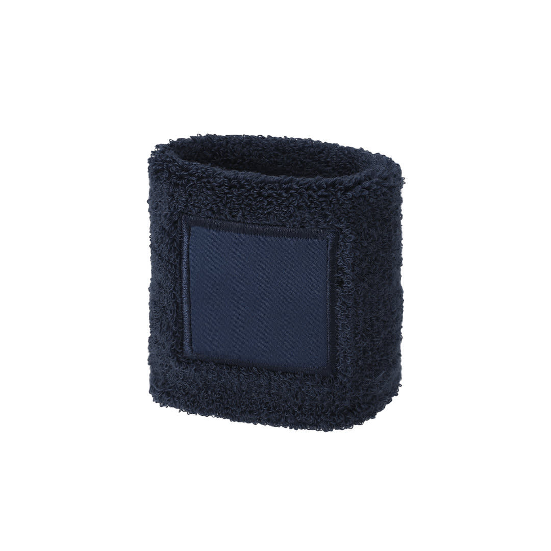 A navy blue wristband with a textured fuzzy exterior and a smooth rectangular patch. It features a logo or branding. Licek Wristband - Image 1