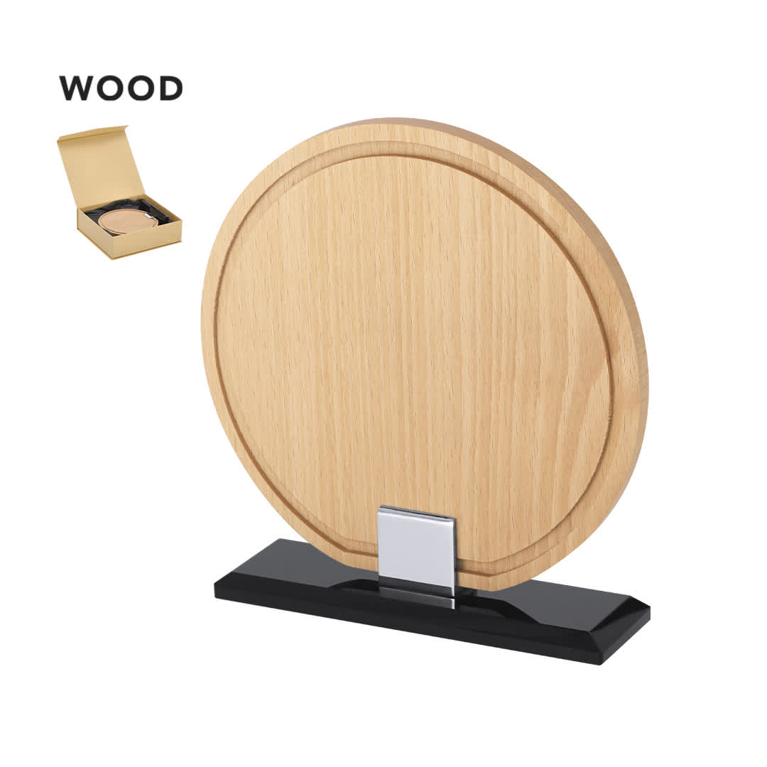 A wooden plaque with a circular design, mounted on a black base, displayed in a box. Vererol Plaque - Image 1