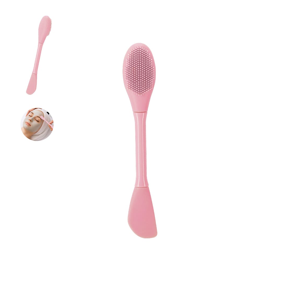 A pink facial spatula with a textured head, designed for beauty and skincare applications. Includes a logo. Baux Facial Spatula - Image 1